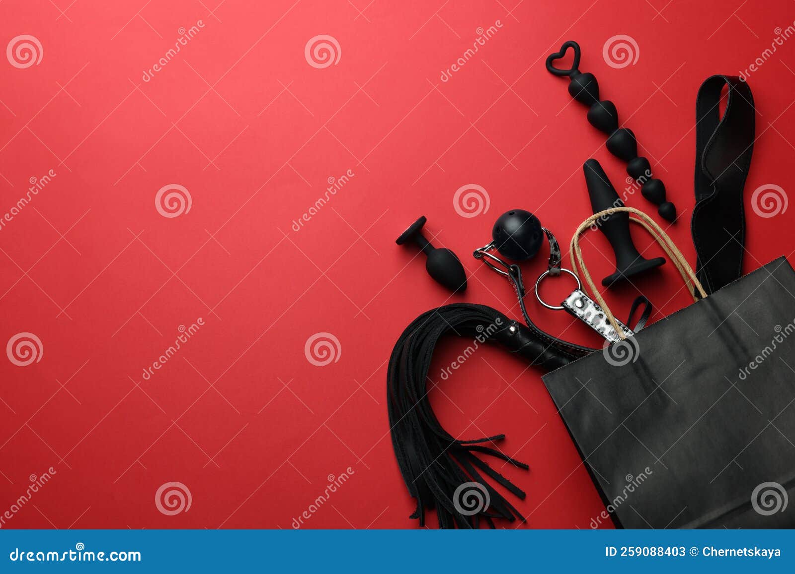 Shopping Bag And Different Sex Toys On Red Background Flat Lay Space