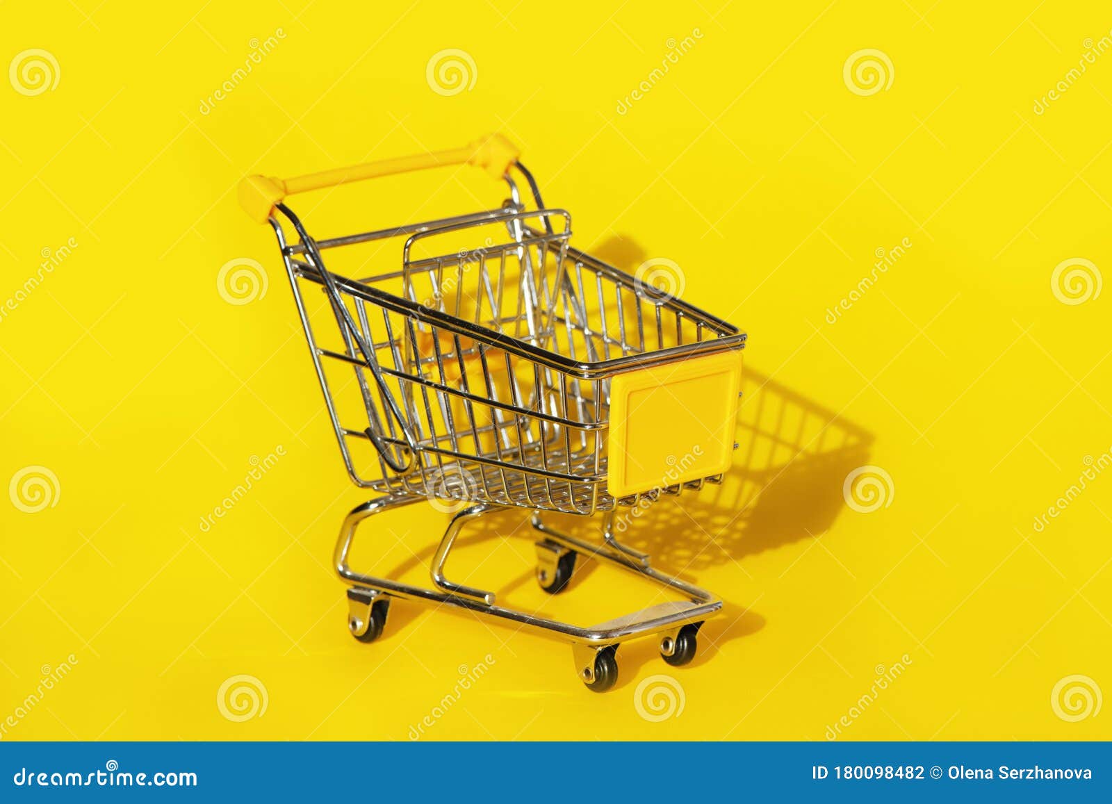 Shopping Cart on Yellow Background. Stock Photo Image of customer