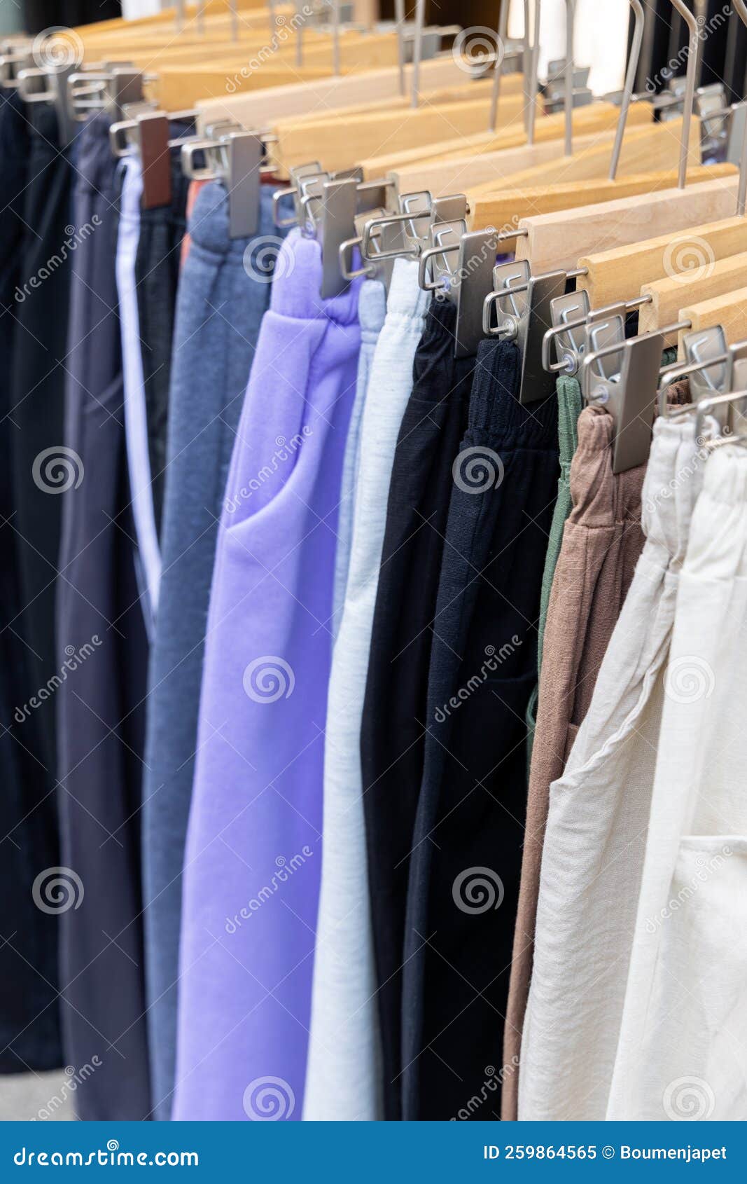 A Shopping Rank Filled with Clothes, Pants, Sports Clothes. Bunch of Clothes  of Different Colors for Sale Stock Image - Image of monday, clothes:  259864565