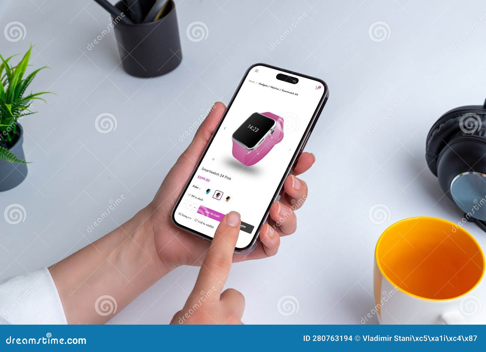 shopping smart watch online with smartphone. person holding a modern smartphone at a table indoor