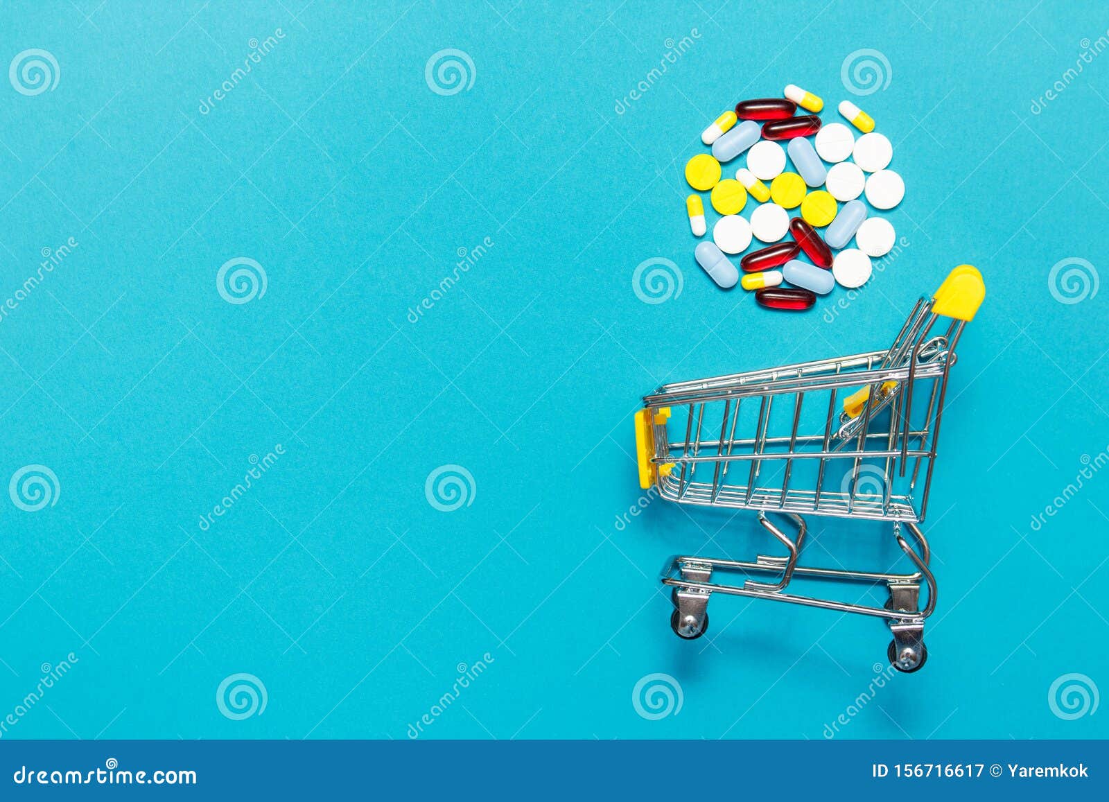 Shopping Trolley Cart with Assorted Medicine Pills One Blue Background