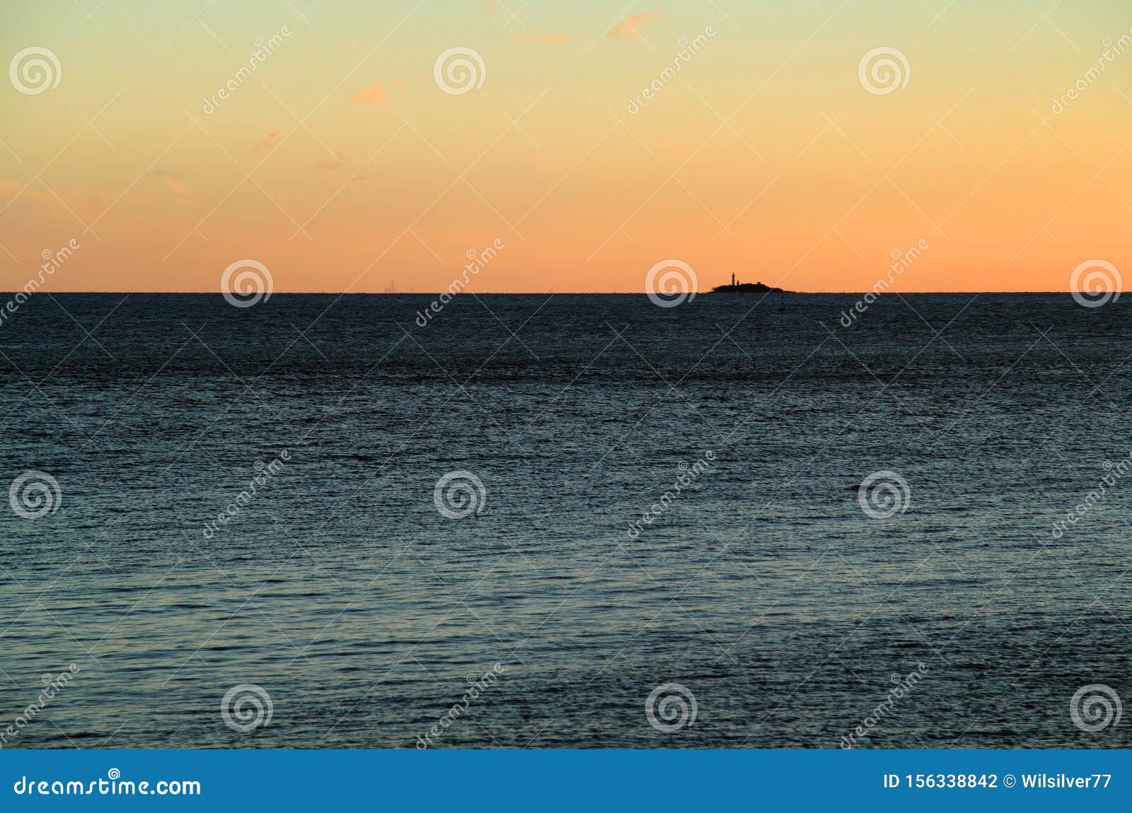 from the shoreline of colonia del sacramento, uruguay, can be seen a small island, the isla de farallon