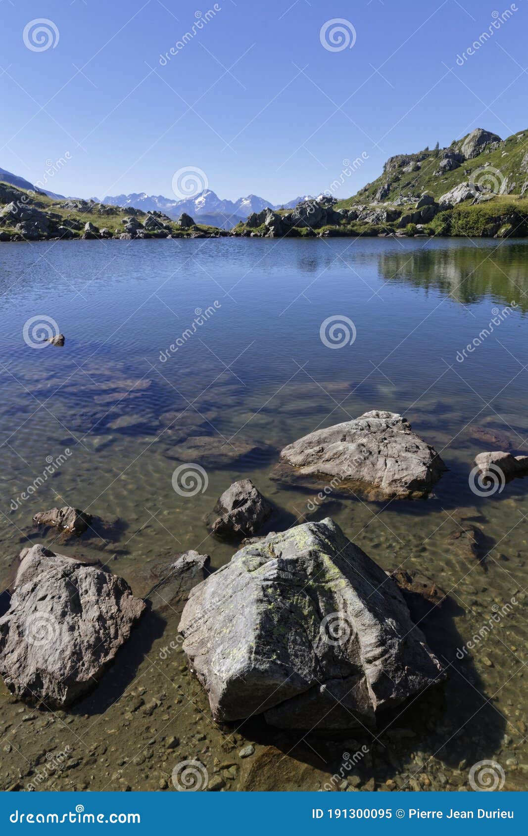 shoreline of the mountain lake in pas de la coche vertical