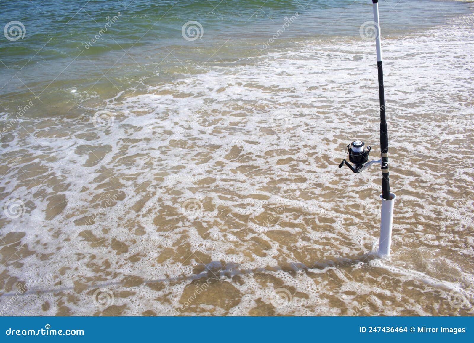 Shoreline Ocean Sea Fishing Pole with Plastic Cylinder Fishing Pole Mount  Holder Spiked in Sand Stock Photo - Image of vacation, tree: 247436464