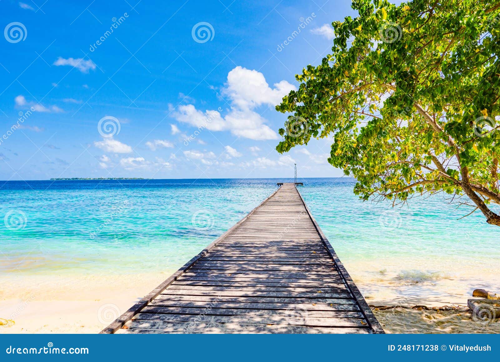 Shoreline and Wooden Jetty Extending into the Indian Ocean. Maldives ...