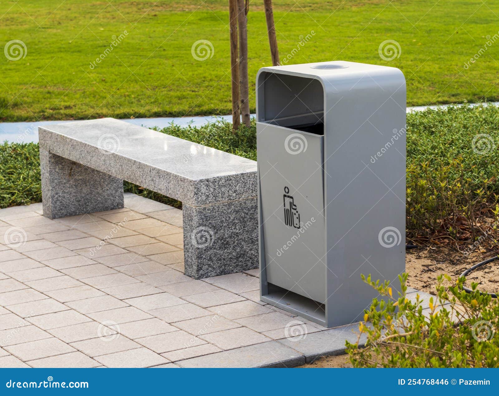 Shot of a Bench and Trash Bin in the Park. Outdoors Stock Photo Image