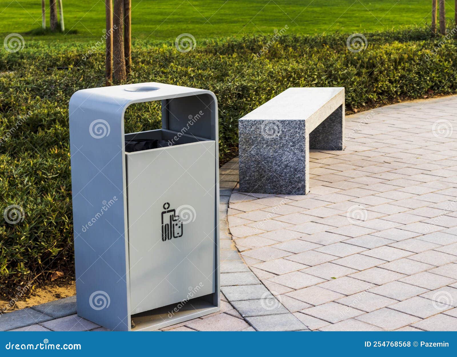 Shot of a Bench and Trash Bin in the Park. Outdoors Stock Photo Image