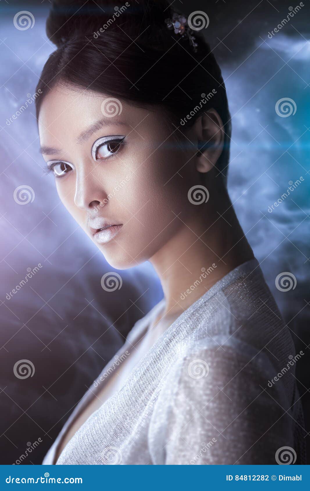 Futuristic Fashion Young Woman. Beautiful Young Multi-racial Asian  Caucasian Model Cyber Girl In Silver Urban Clothes With Conceptual  Hairstyle And Make-up Against White Background In Full Lenght. Sci-fi  Poster Style. Stock Photo