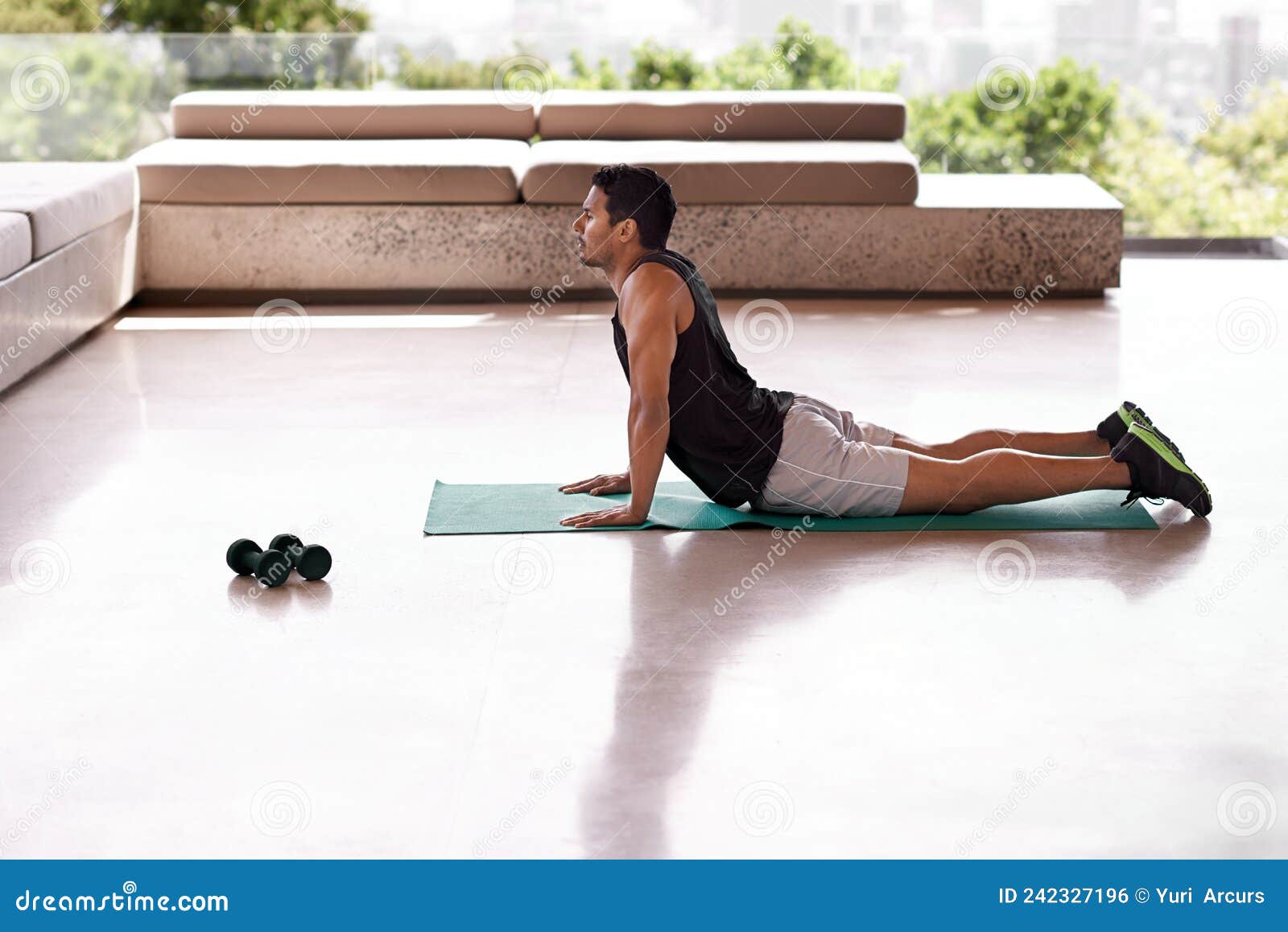 Serious Beautiful Female in Sportswear Doing Exercise Outdoors