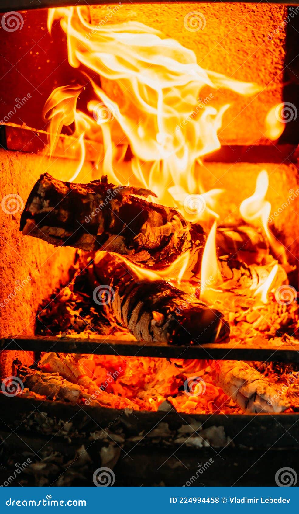 Logs of Wood Burning in the Fireplace in the House. Stock Photo Image