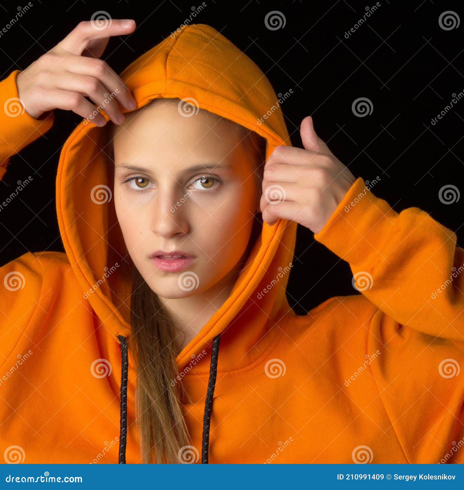 Shot Of Pretty Teenage Girl Putting The Hood On Stock Image Image Of Posing Hood 210991409 