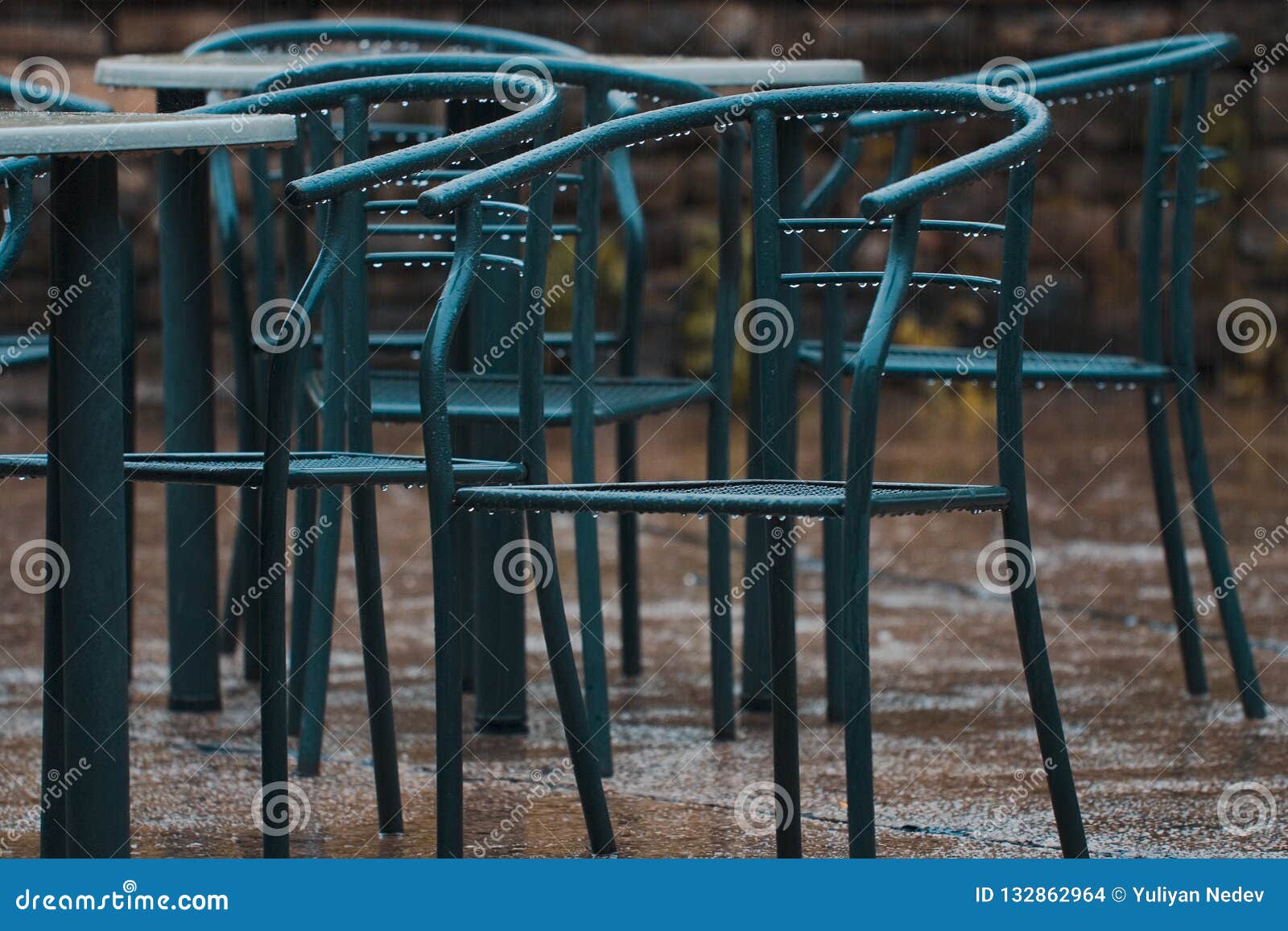 A Shot at Several Green Metal Chairs in the Rain Stock Photo Image of