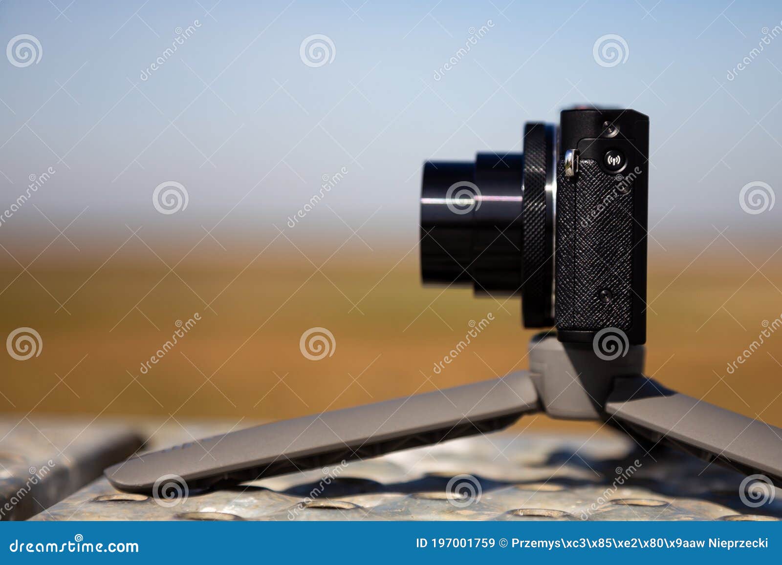 compact camera on small tripod