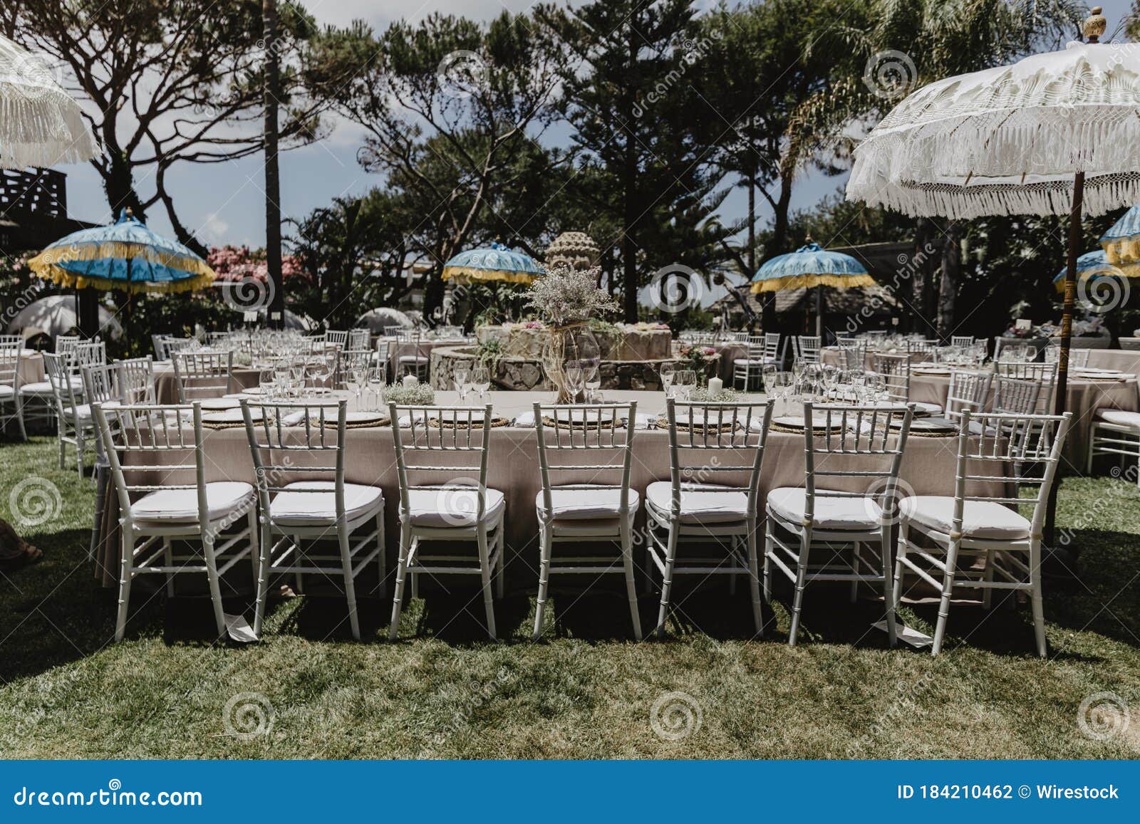 Shot of White Dining Tables and Chairs for the Wedding Outdoors Stock