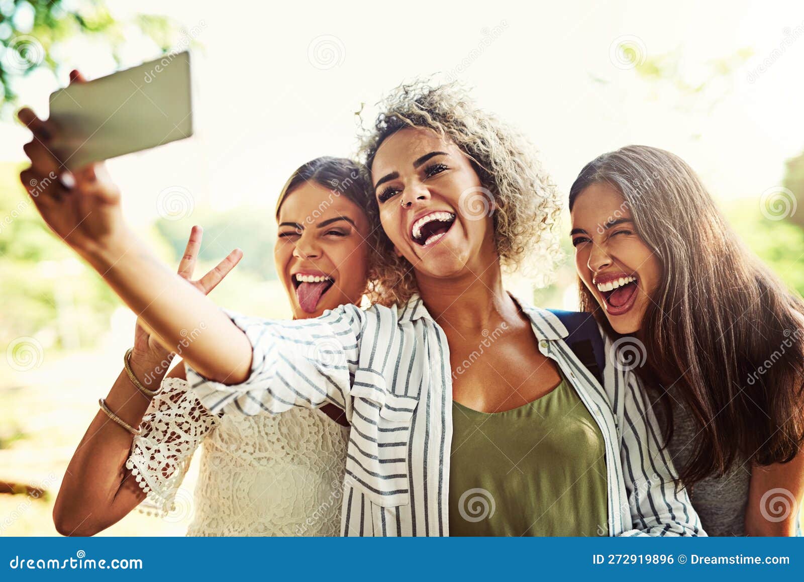 Premium Photo | A group of five lively women are taking a selfie on a sunny  day with a leafy tree in the background