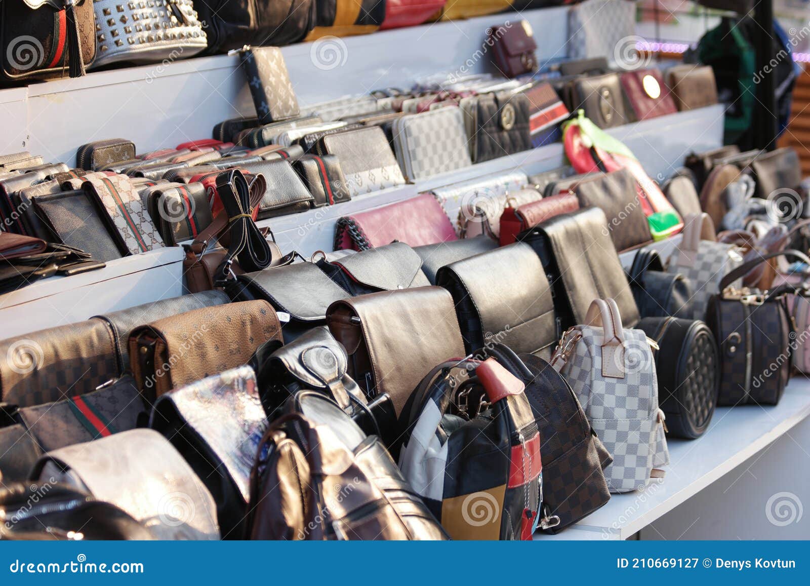 Showcase with Fake Handbags of Famous Brands. Stock Image - Image