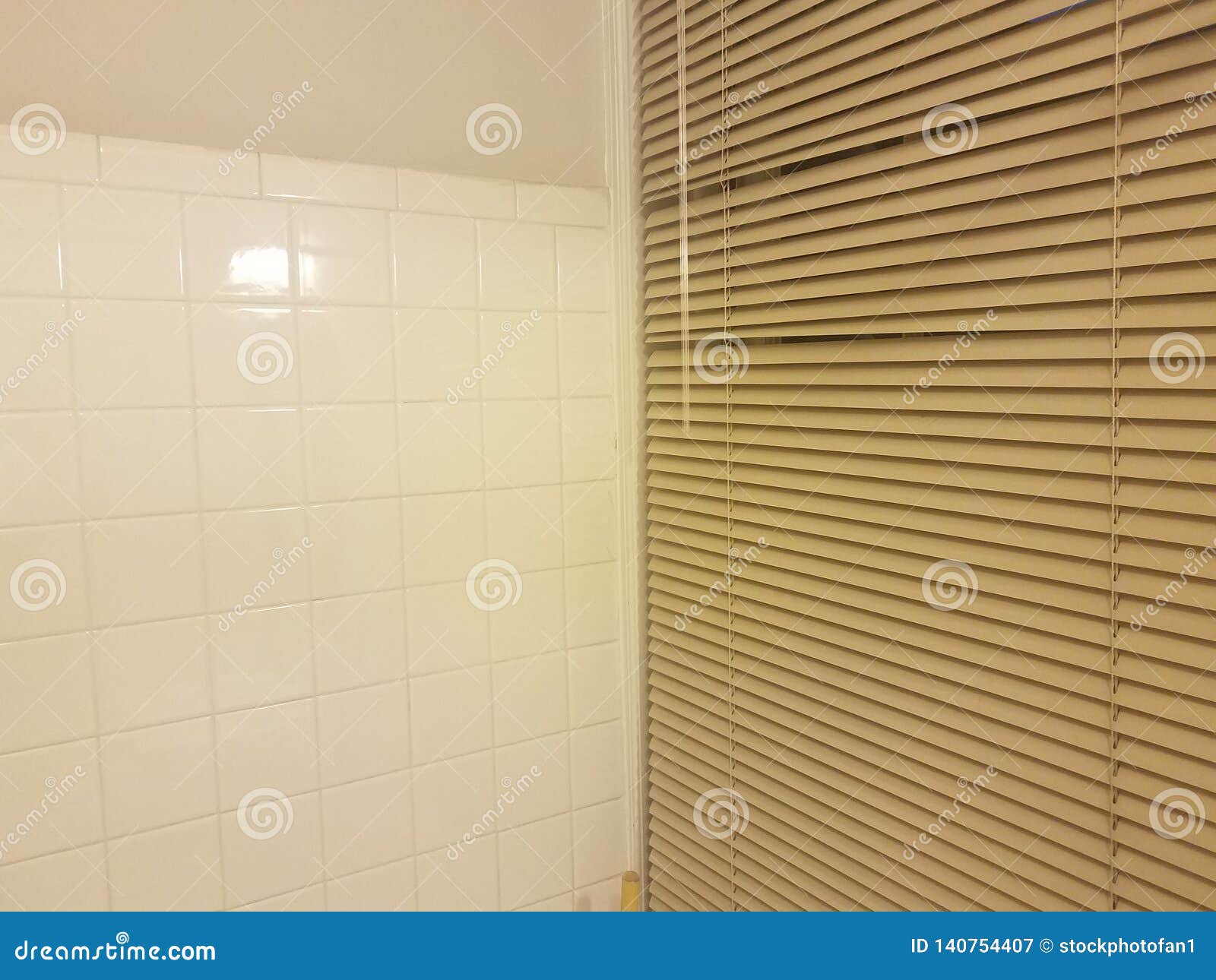 Shower in Bathroom with White Tiles and Window with Blinds Stock Image