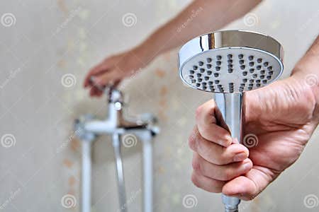 Plumber Fixed Leaking Shower Head on Flexible Hose. Stock Photo - Image