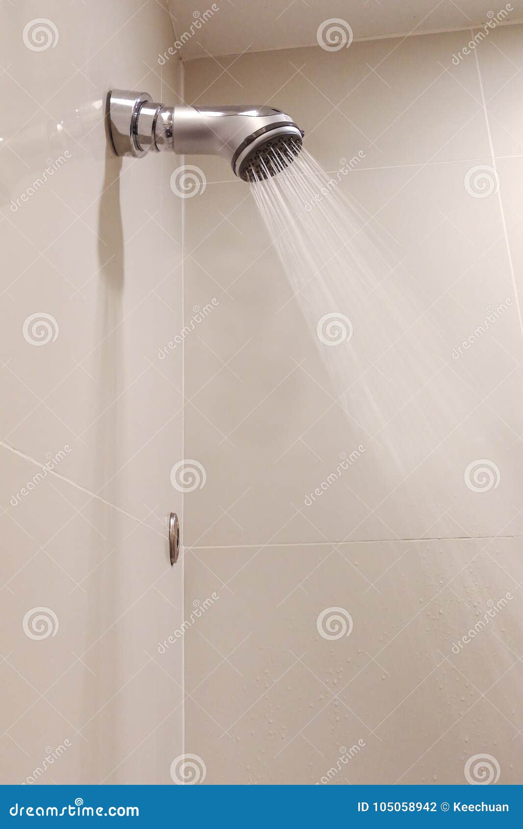 Shower Head with Refreshing Water Droplets Spray in Bathroom Stock