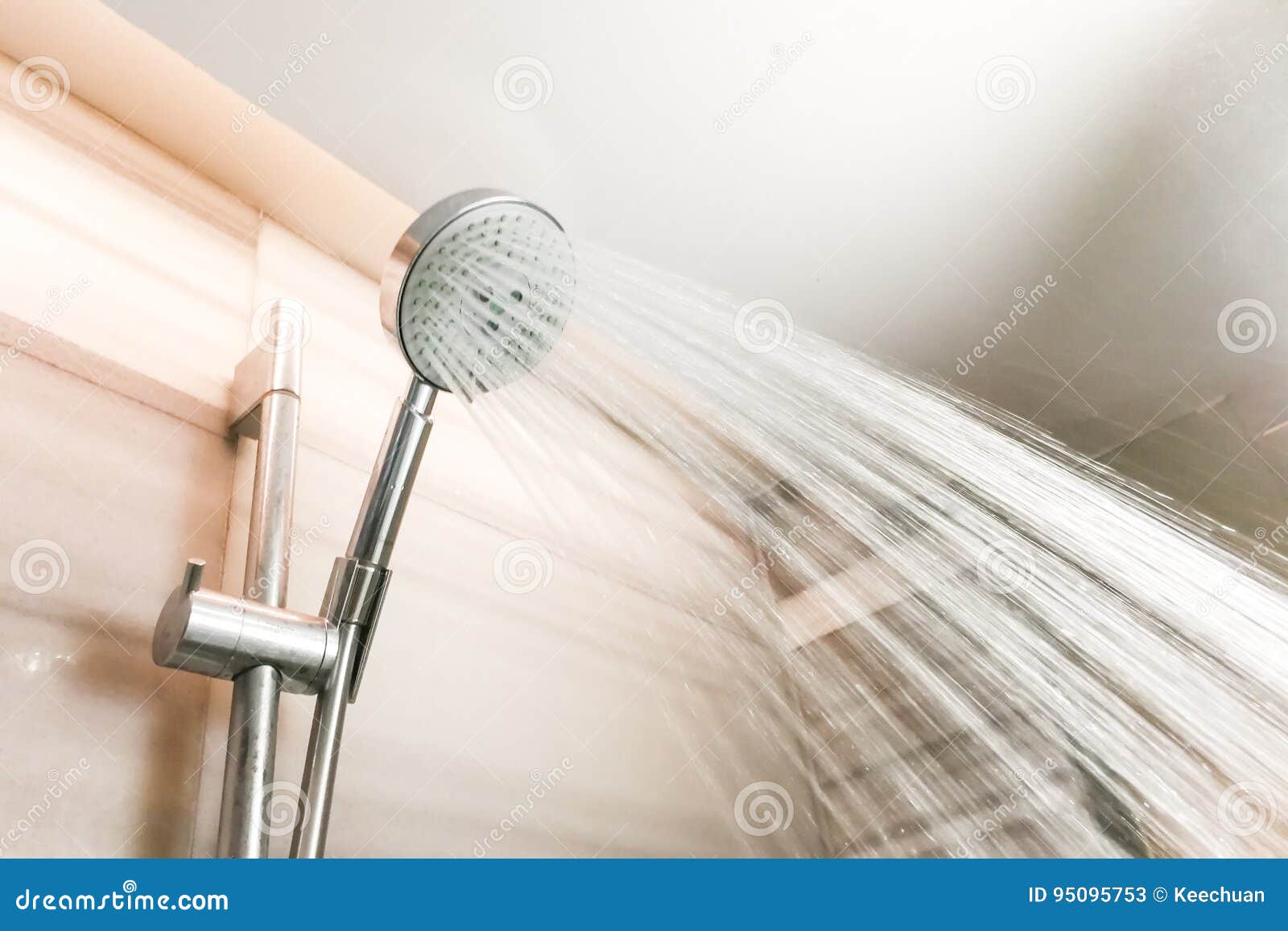 Shower Head with Refreshing Water Droplets Spray in Bathroom Stock