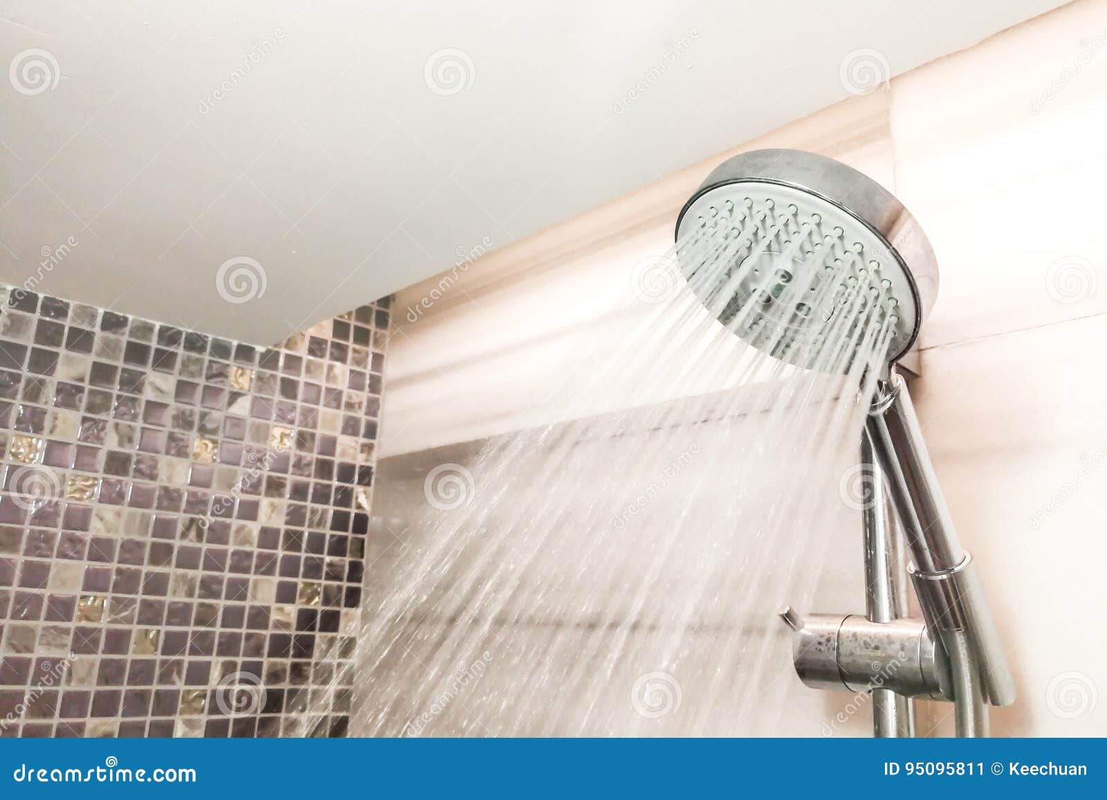 Shower Head with Refreshing Water Droplets Spray in Bathroom Stock