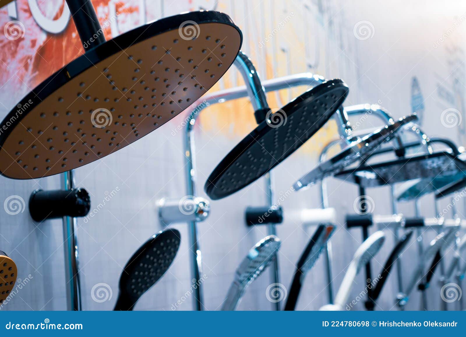 Shower Heads. Glossy Round Shower Over the Ceilings in the Bathroom