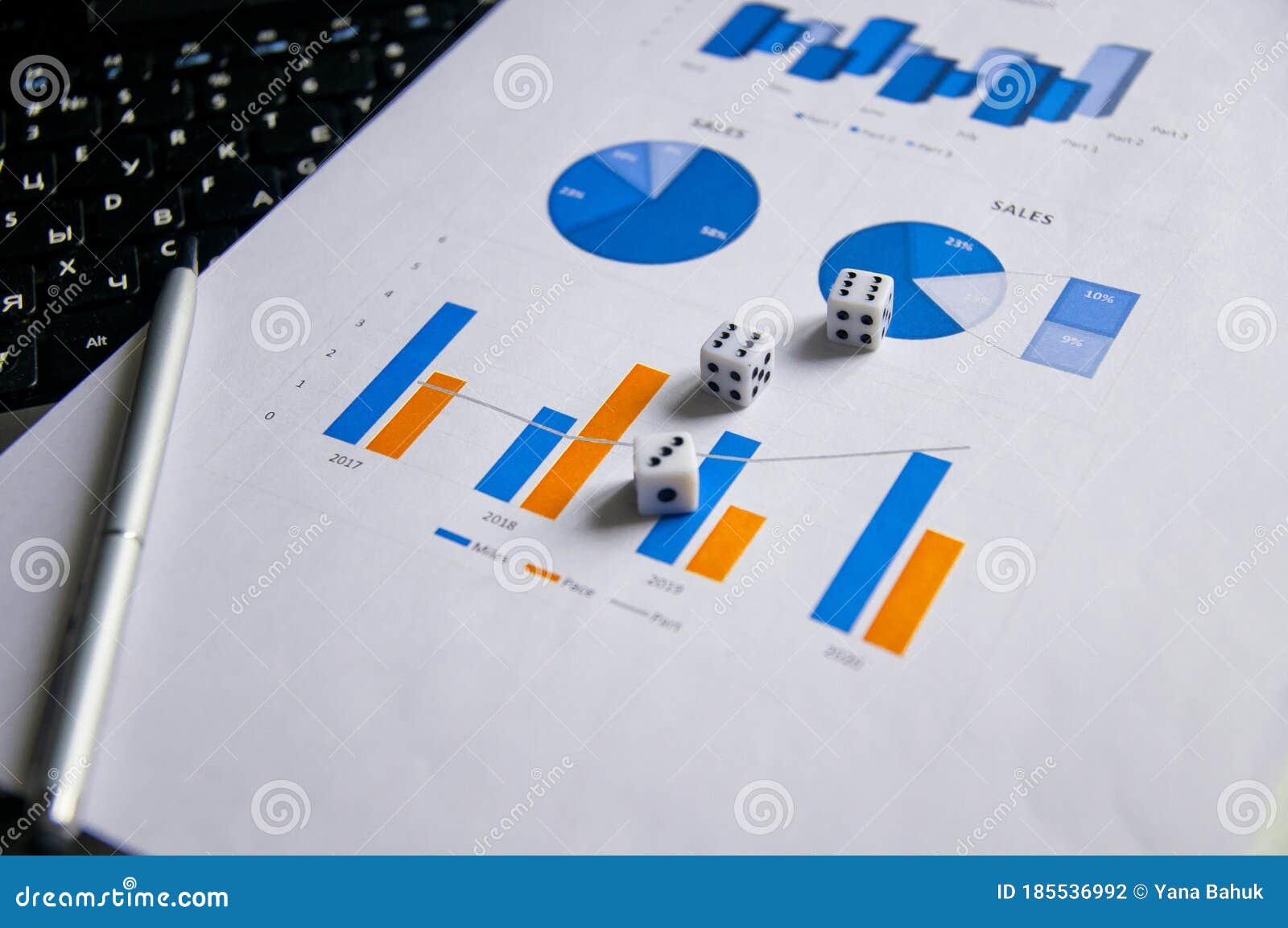 showing business and financial report. accounting. business ideas concept with dice gambling risk currency on keyboard and