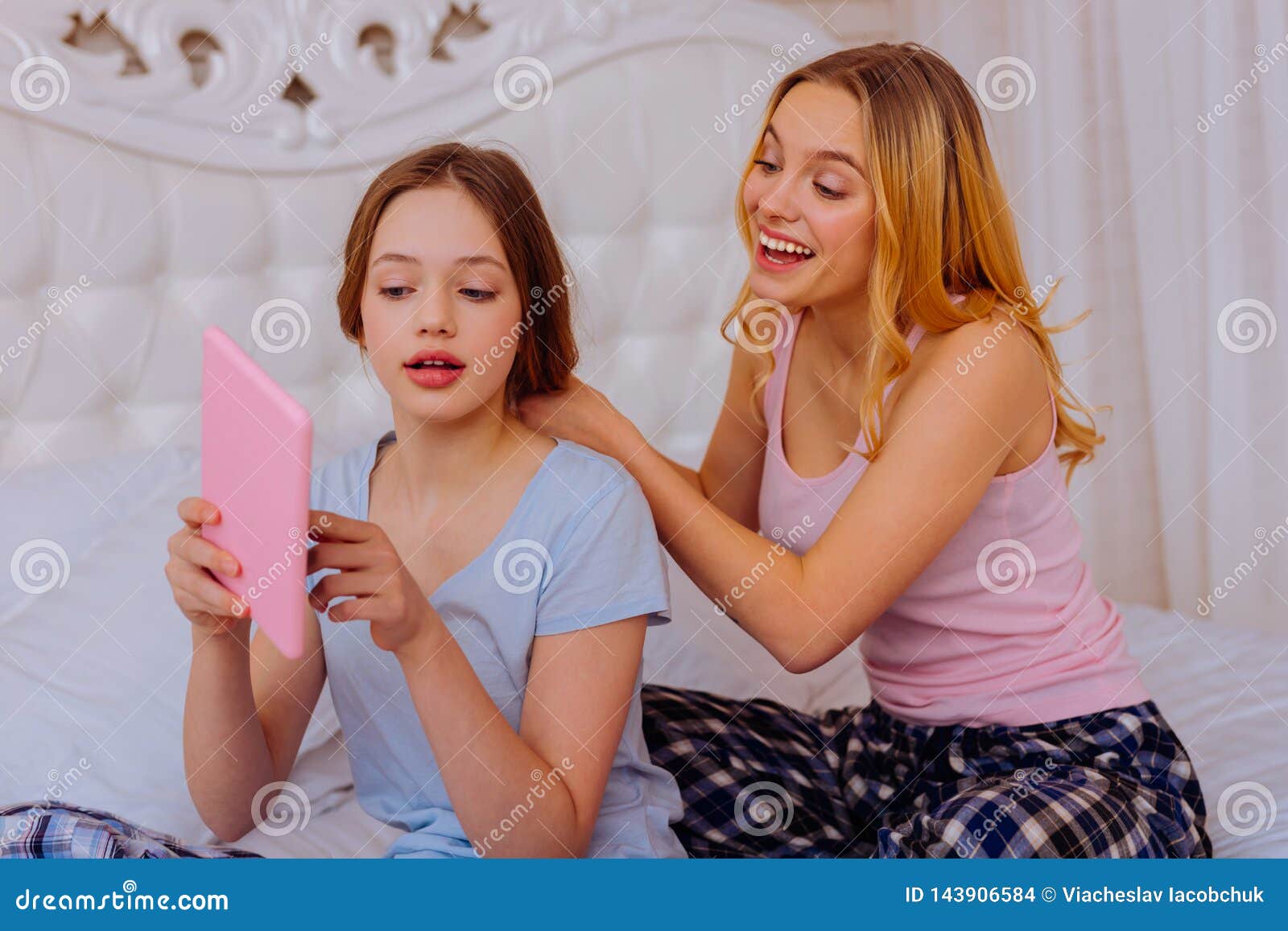 Sister Shopping Online and Showing Dress while Older Sister Doing ...