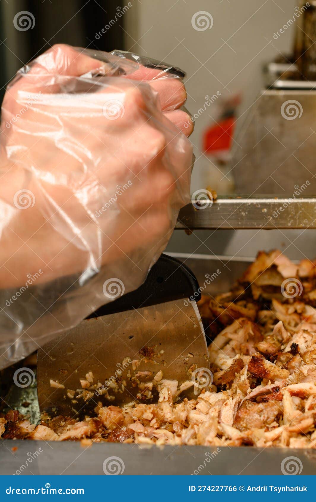 Shredding Meat in a Fast Food Kitchen for Shawarma, Fried Chicken