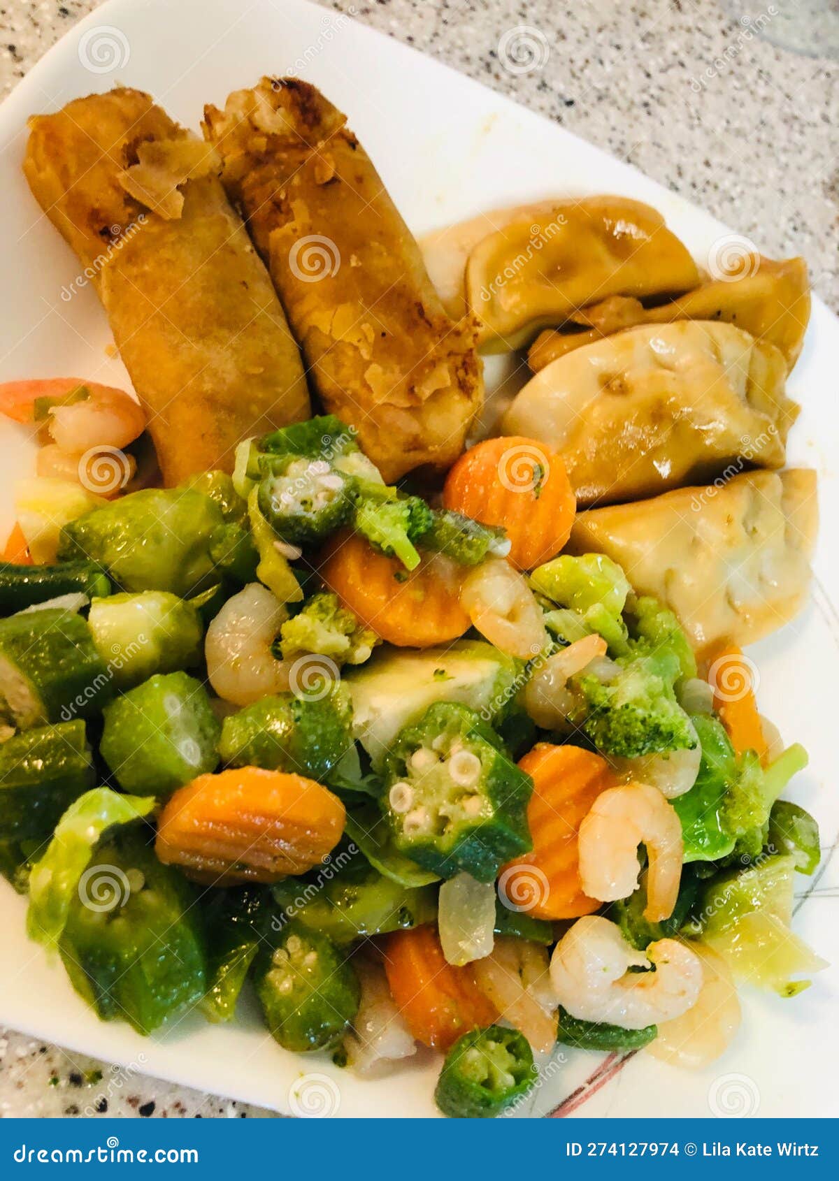 Shrimp Vegetable Stir Fry, Spring Egg Rolls, Pork Raviolis, Stock Photo