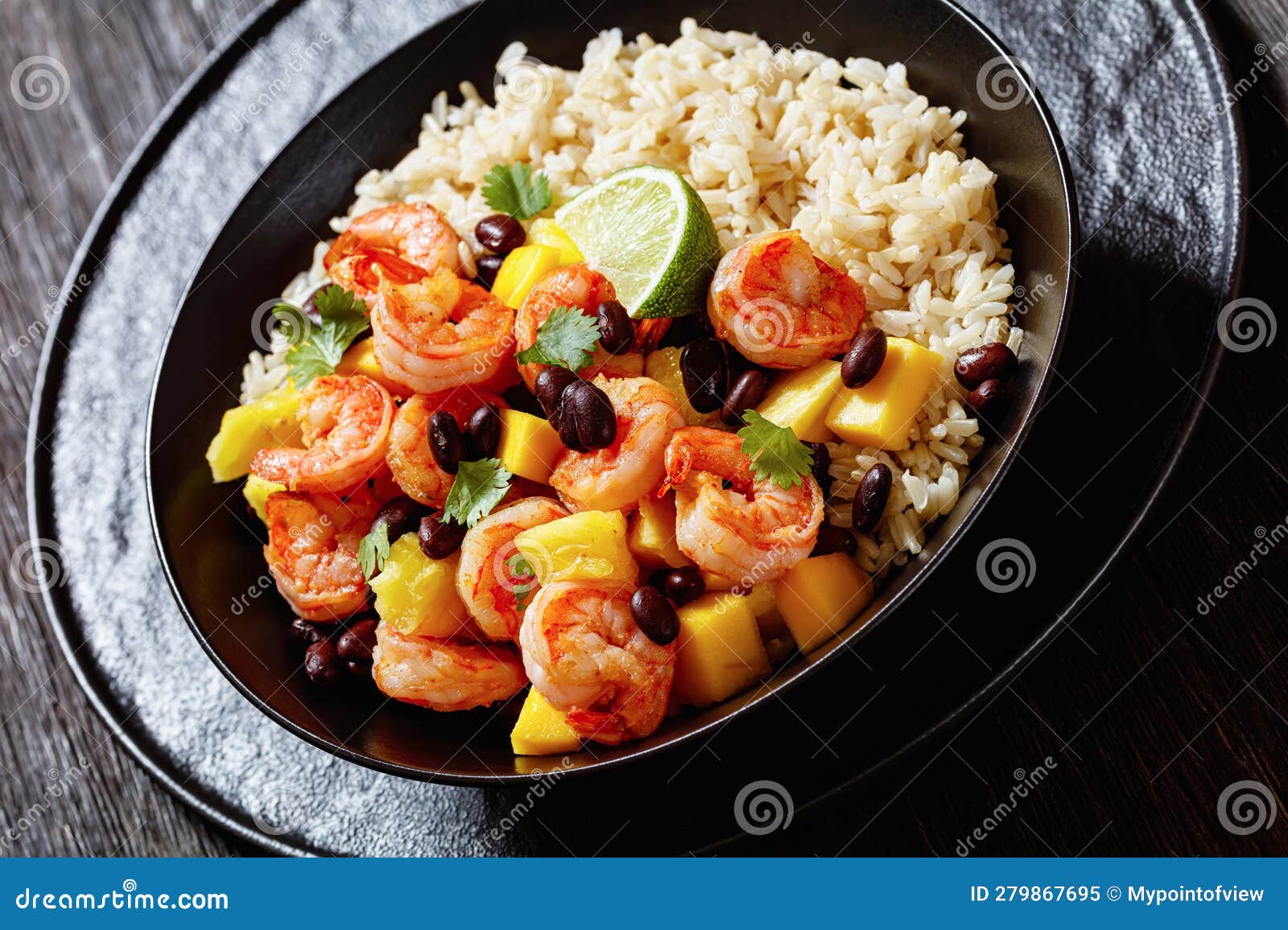 shrimps with beans, mango, brown rice in bowl