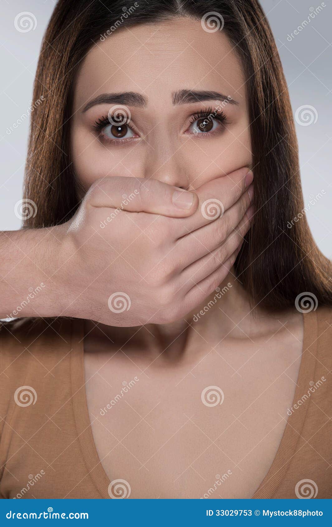 shut-up-shocked-young-woman-looking-camera-someone-covering-her-mouth-hand-33029753.jpg