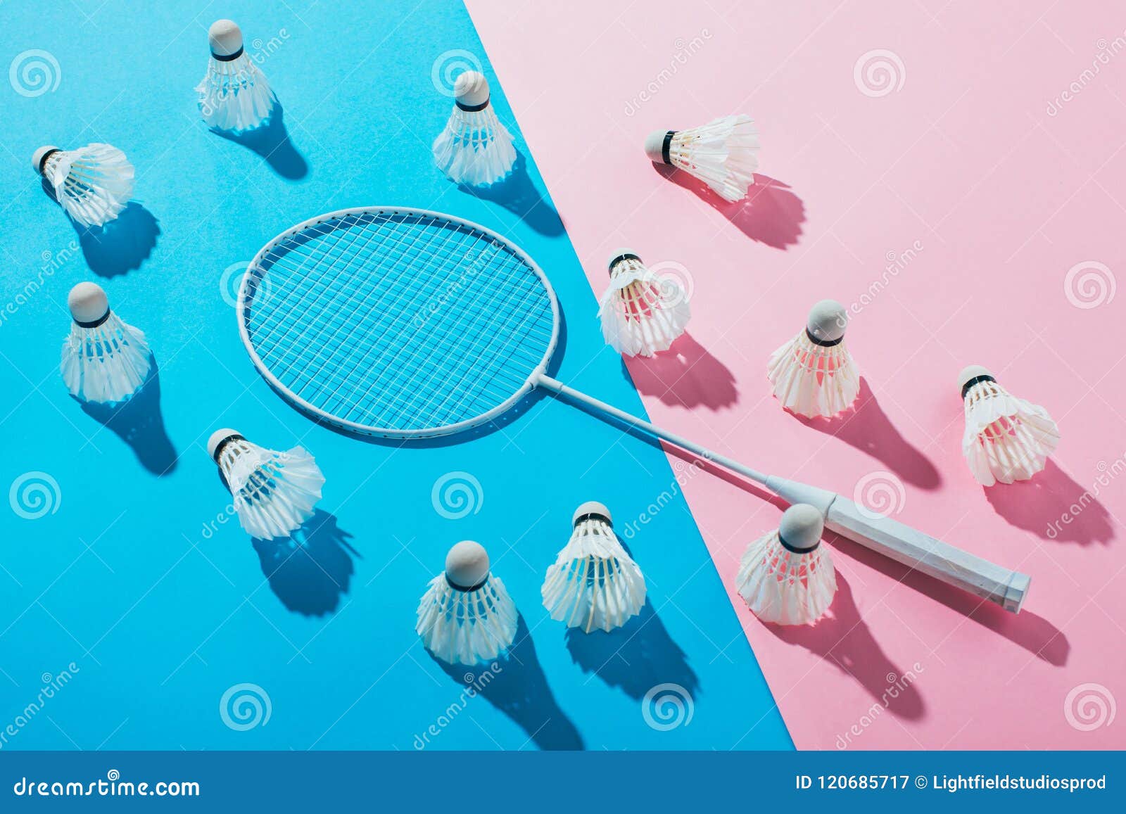 Shuttlecocks Around Badminton Racket On Blue Stock Photography 118813946