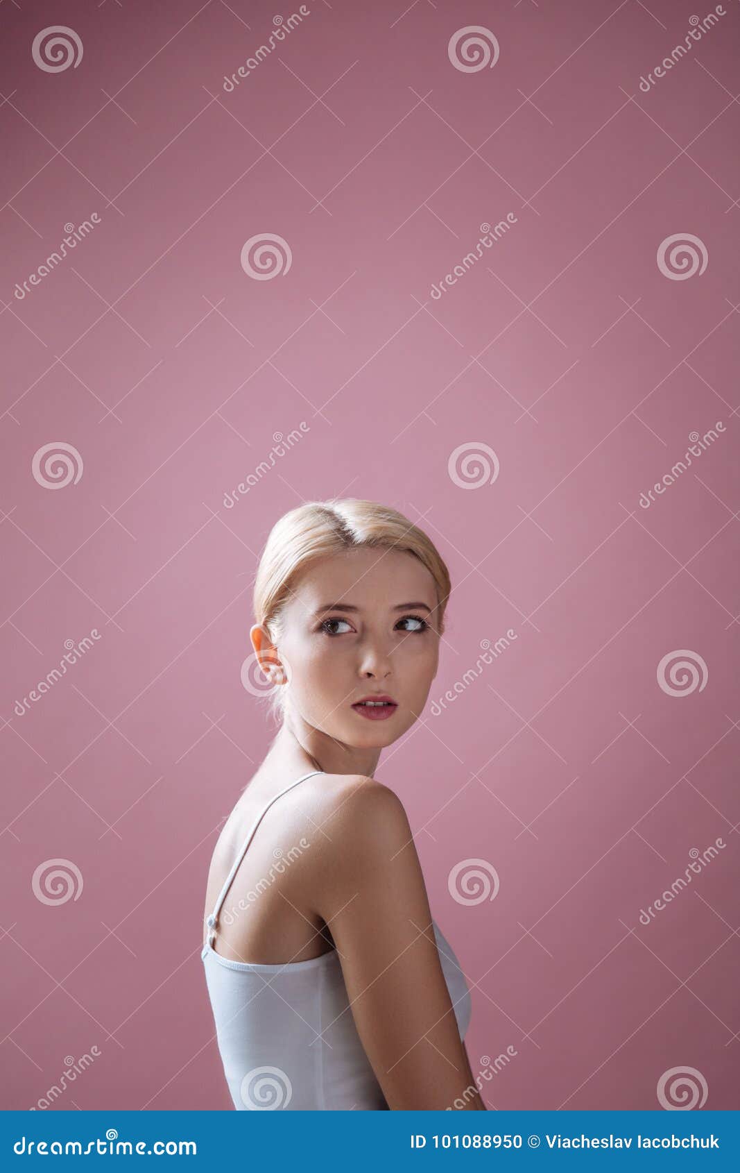 Shy Blonde Female Looking Upwards Stock Photo
