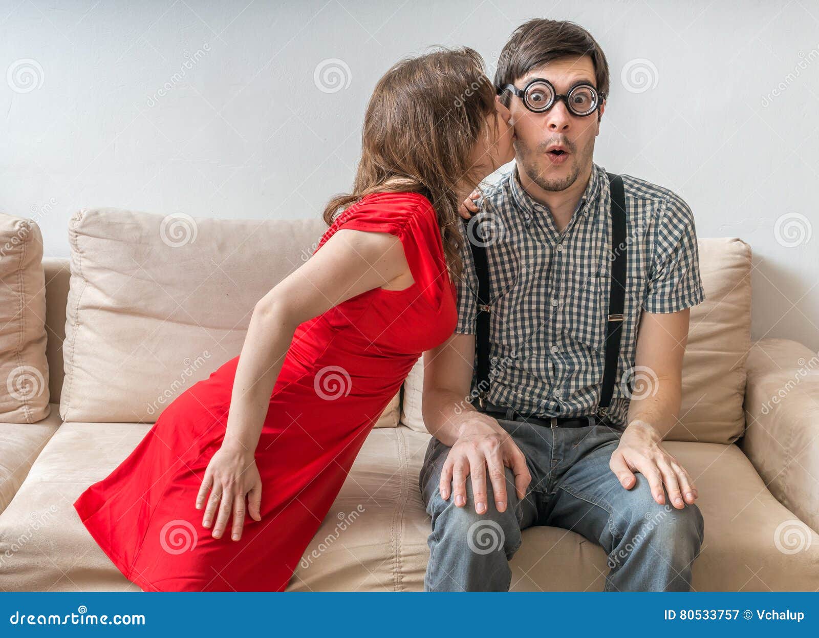 Shy Man Is Surprised By Kiss From Woman Sitting On Sofa Dating Concept Stock Image Image Of
