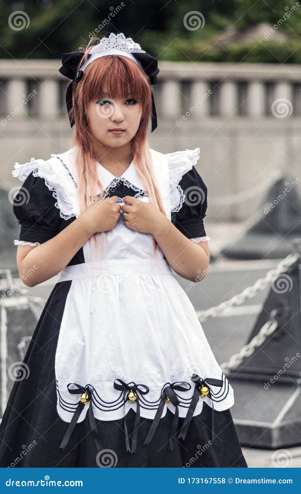 Shy Teenage Cosplay Girl Wearing Maid Outfit In Harajuku