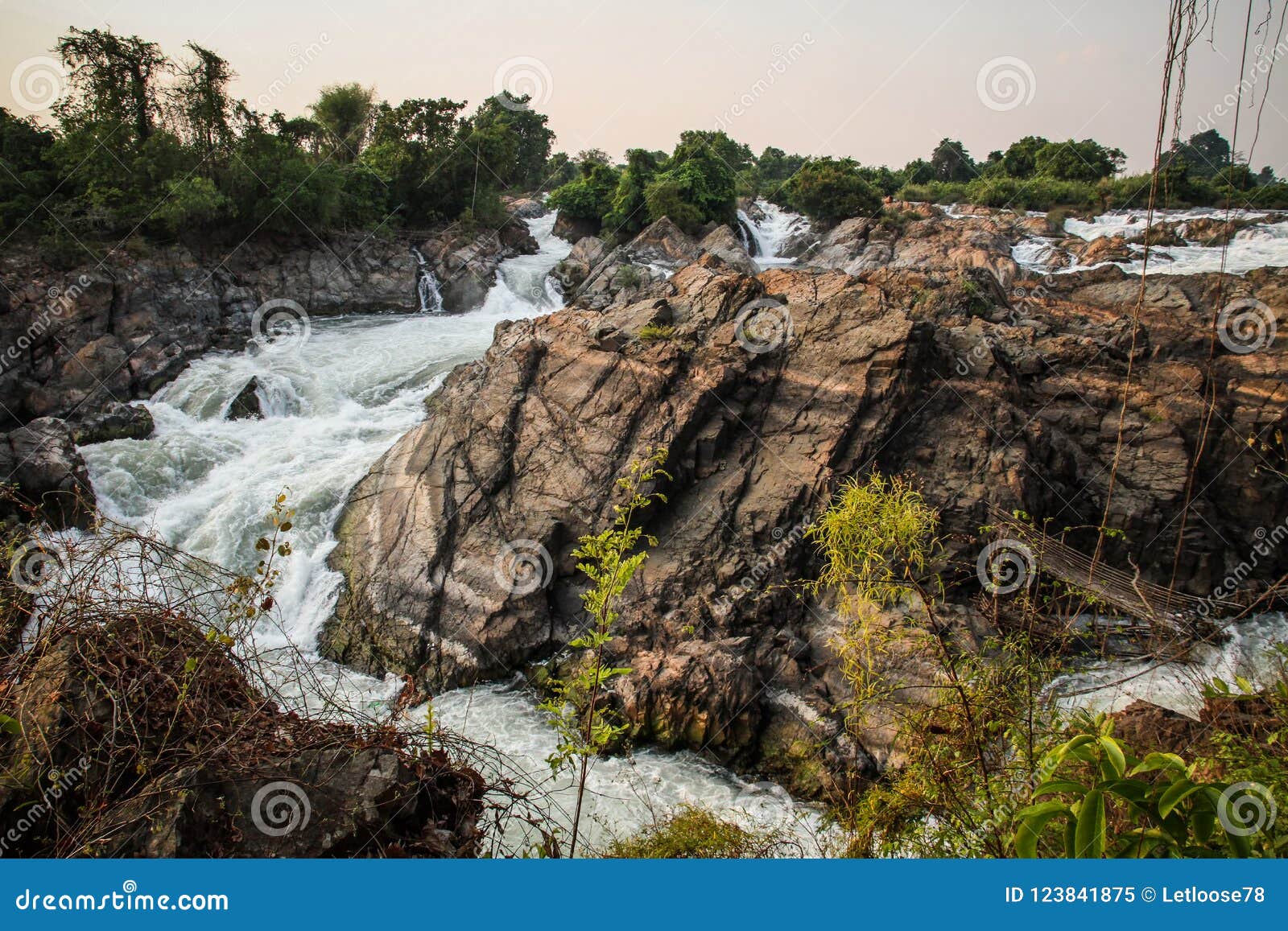 the tat somphamit waterfall at sundown, don khon, si phan don, champasak province, laos