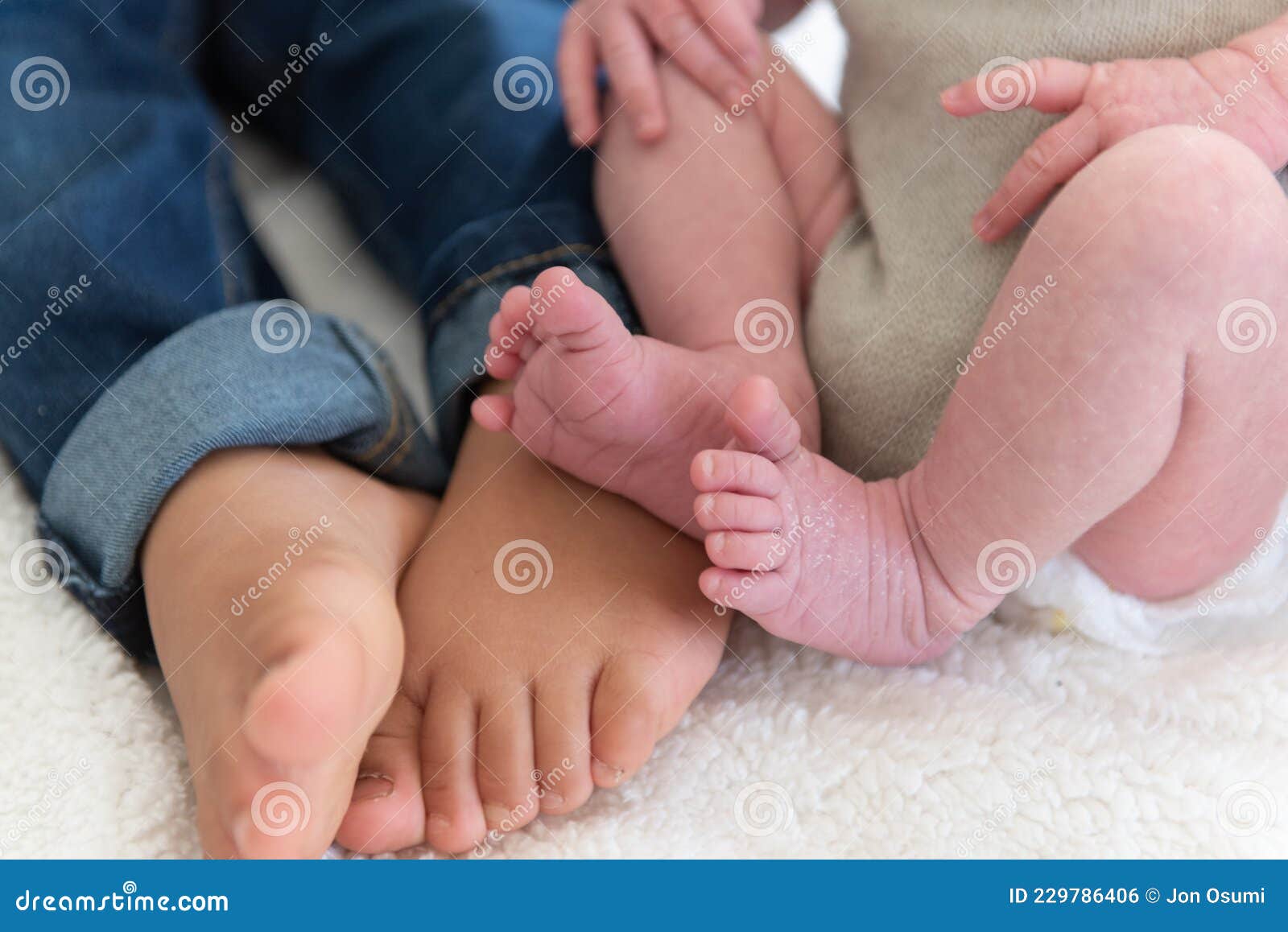 Siblings Feet Compared with Baby Stock Photo - Image of small, brother:  229786406