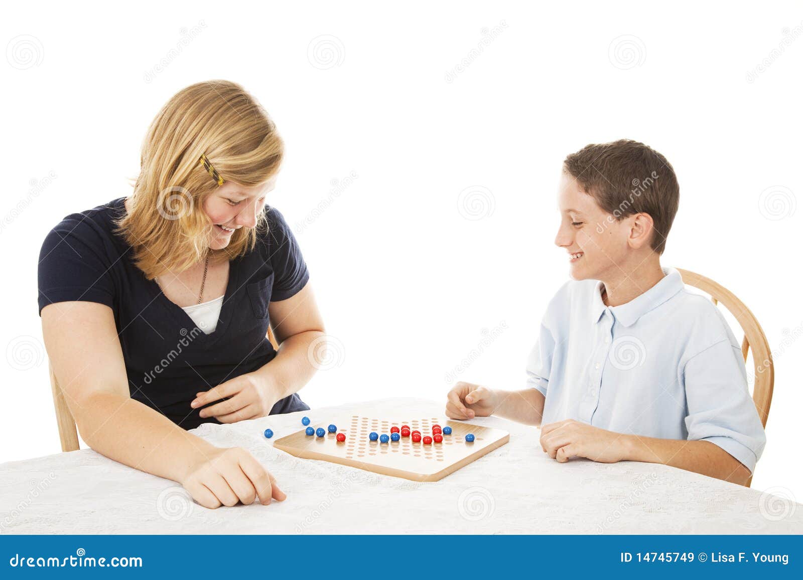 Siblings Play Board Game stock image. Image of blond 14745749