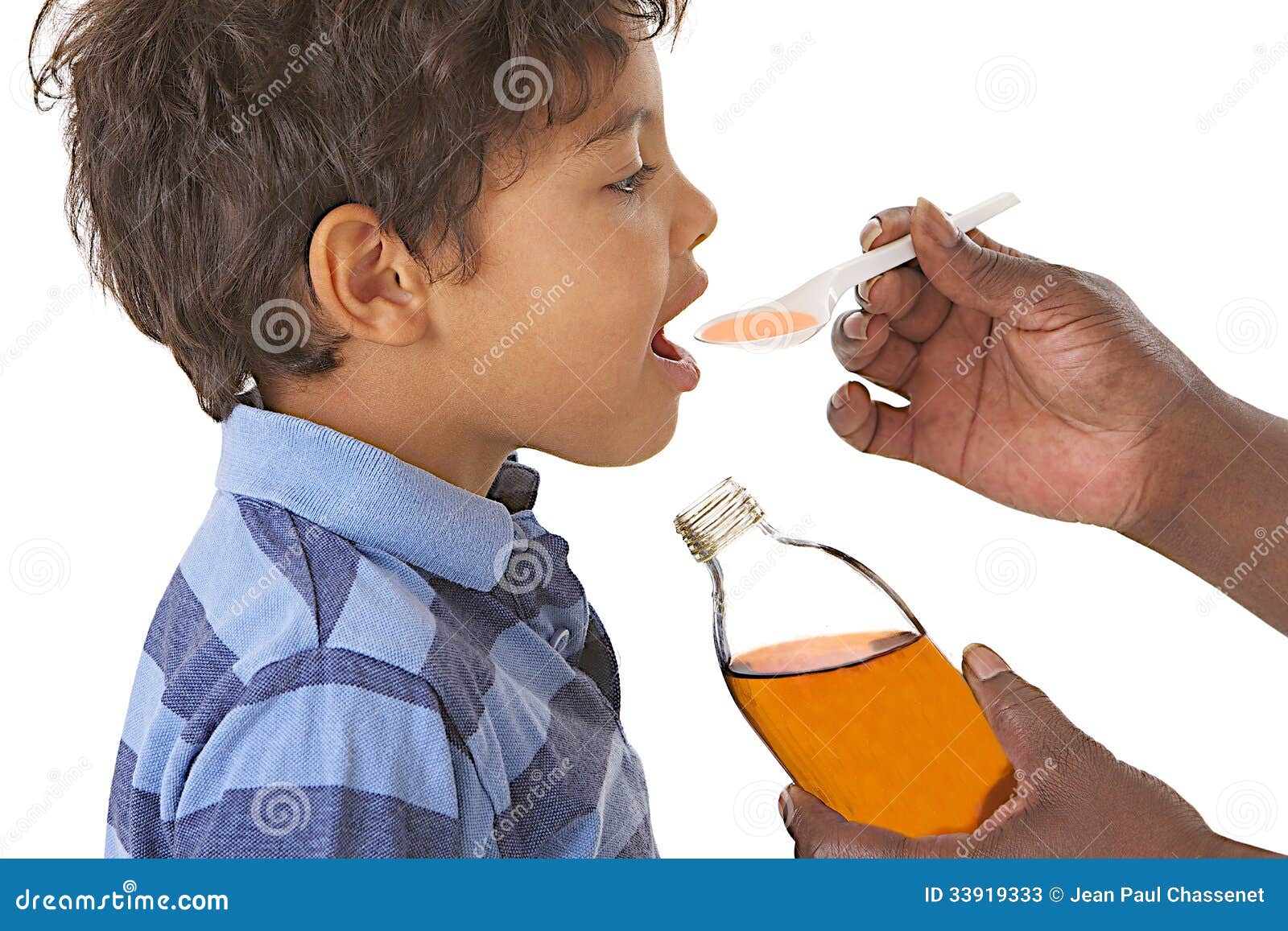 sick child taking syrup against cough or flu