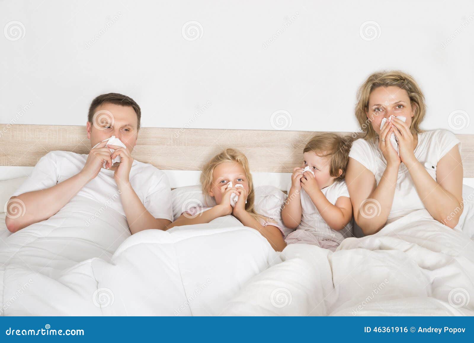 sick family lying in bed