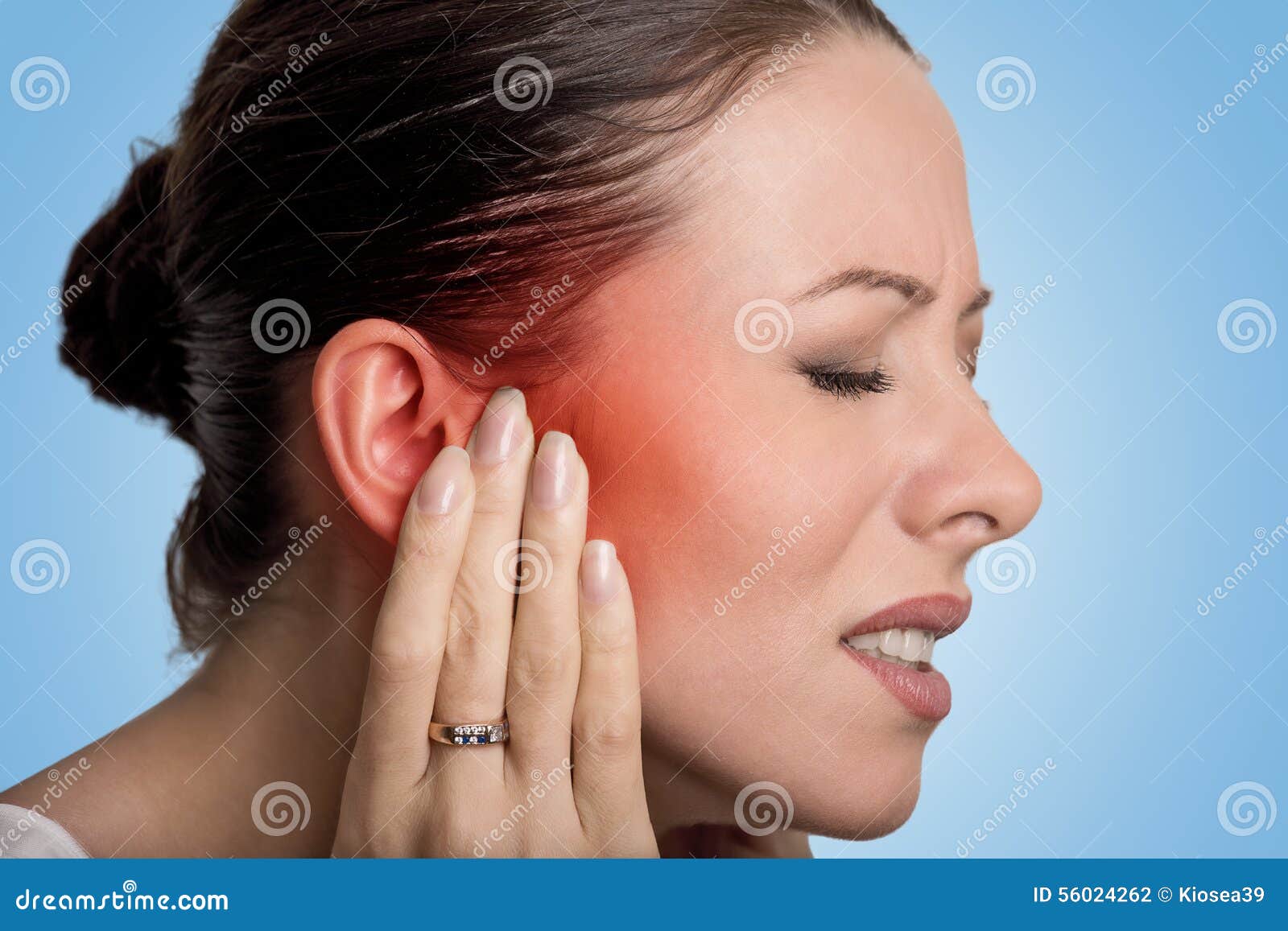 sick female having ear pain touching her painful head