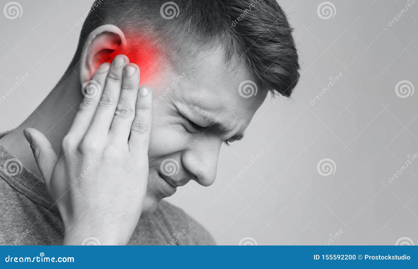 sick man having ear pain, touching his painful head