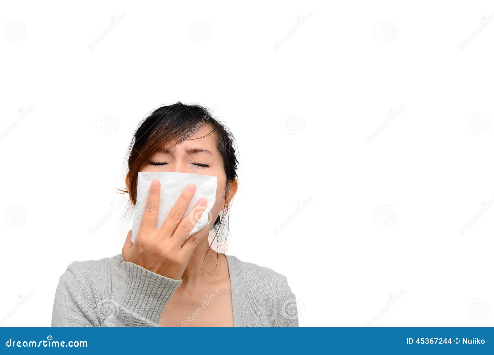 Sick Asian woman blowing her nose isolated.