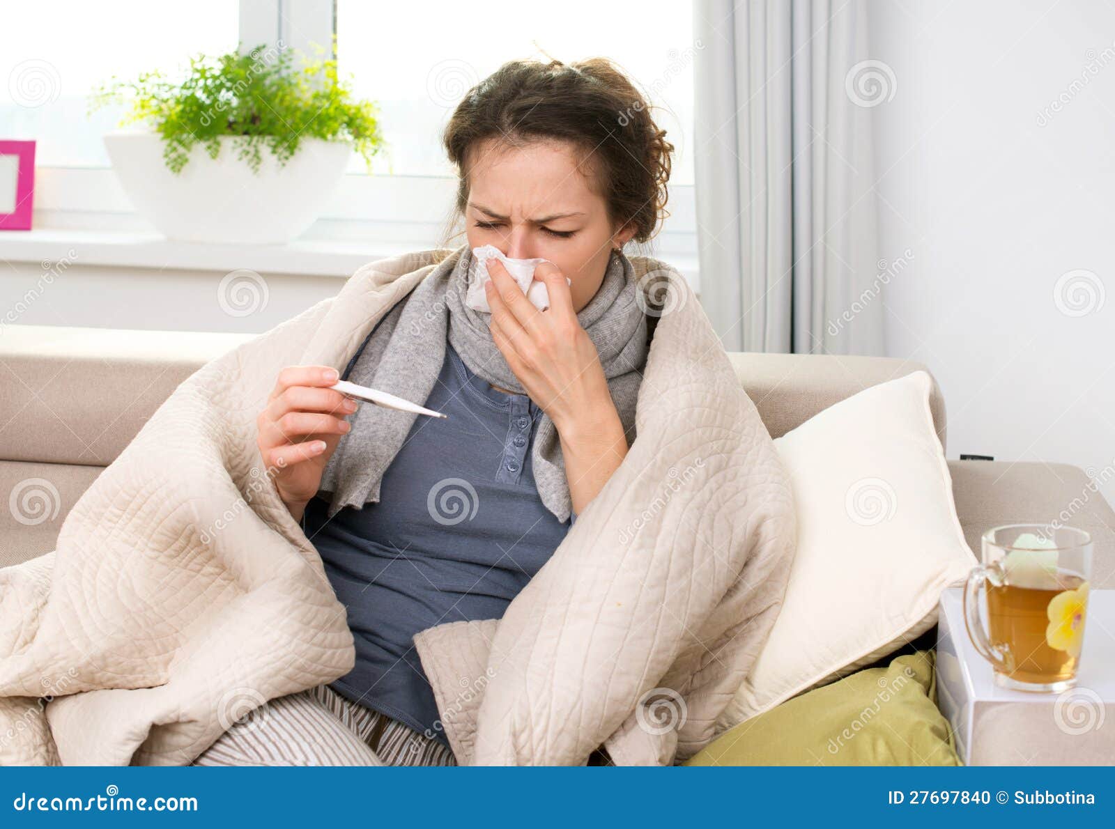 sick woman with thermometer. flu