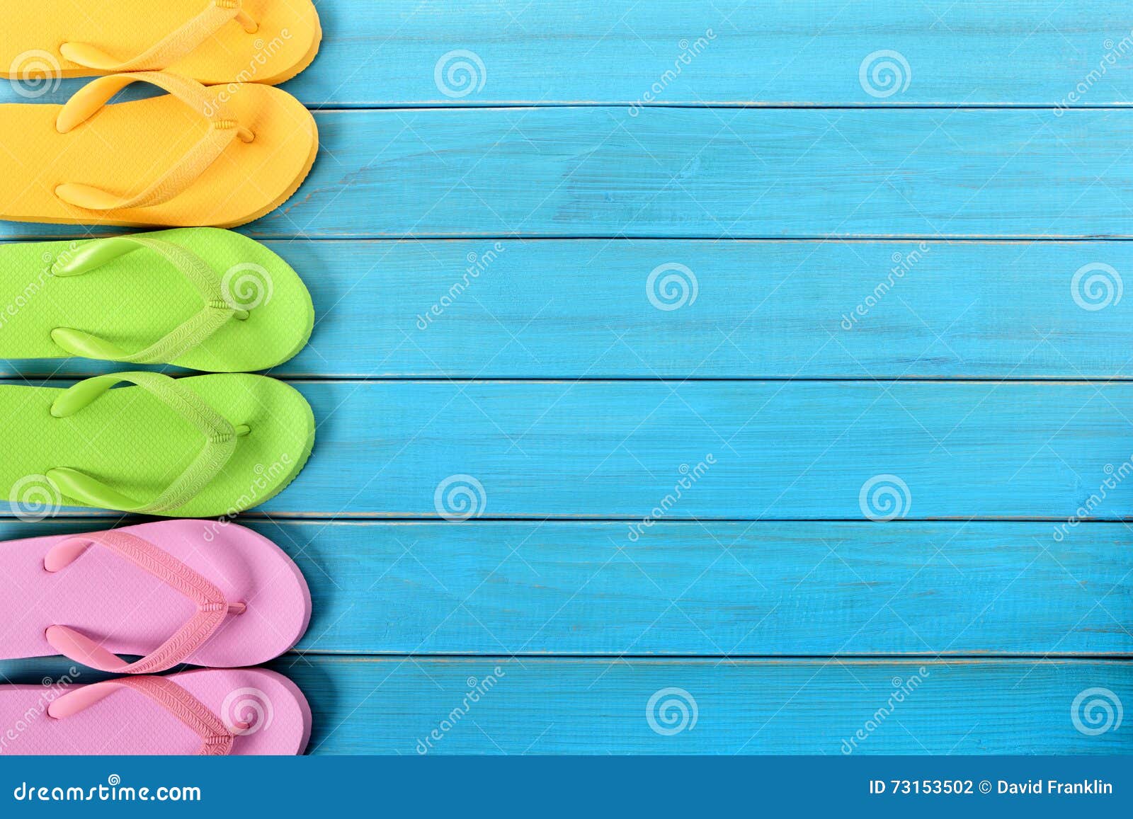 Side Border Row of Flip-flops on Blue Background Wood Deck Stock Photo ...