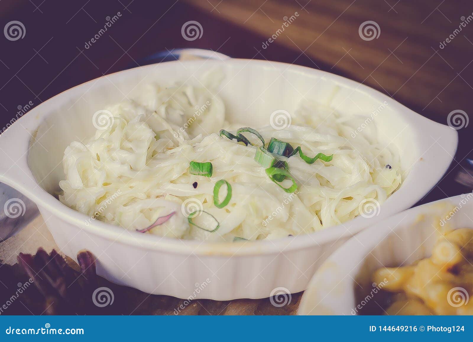 Side Dish White Cabbage Coleslaw in Mayonnaise Dressing with Spring