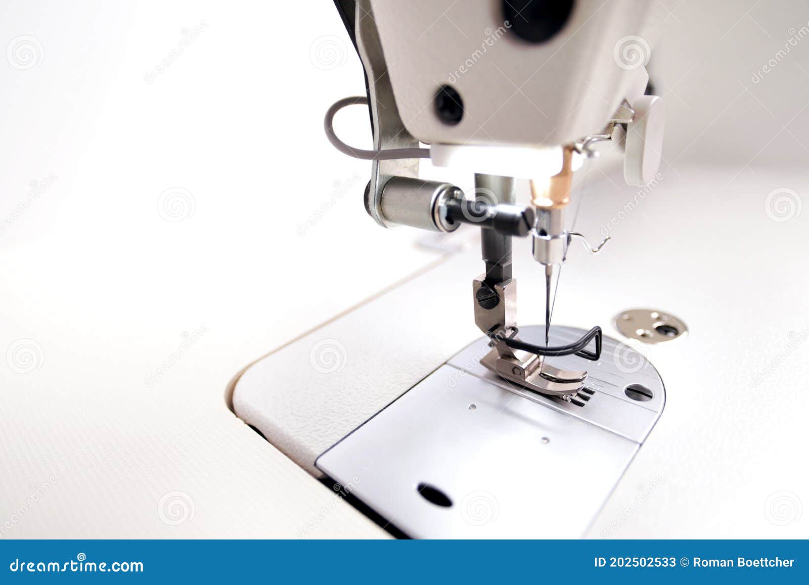 Machine Head of a Modern Industrial Sewing Machine Equipped with a