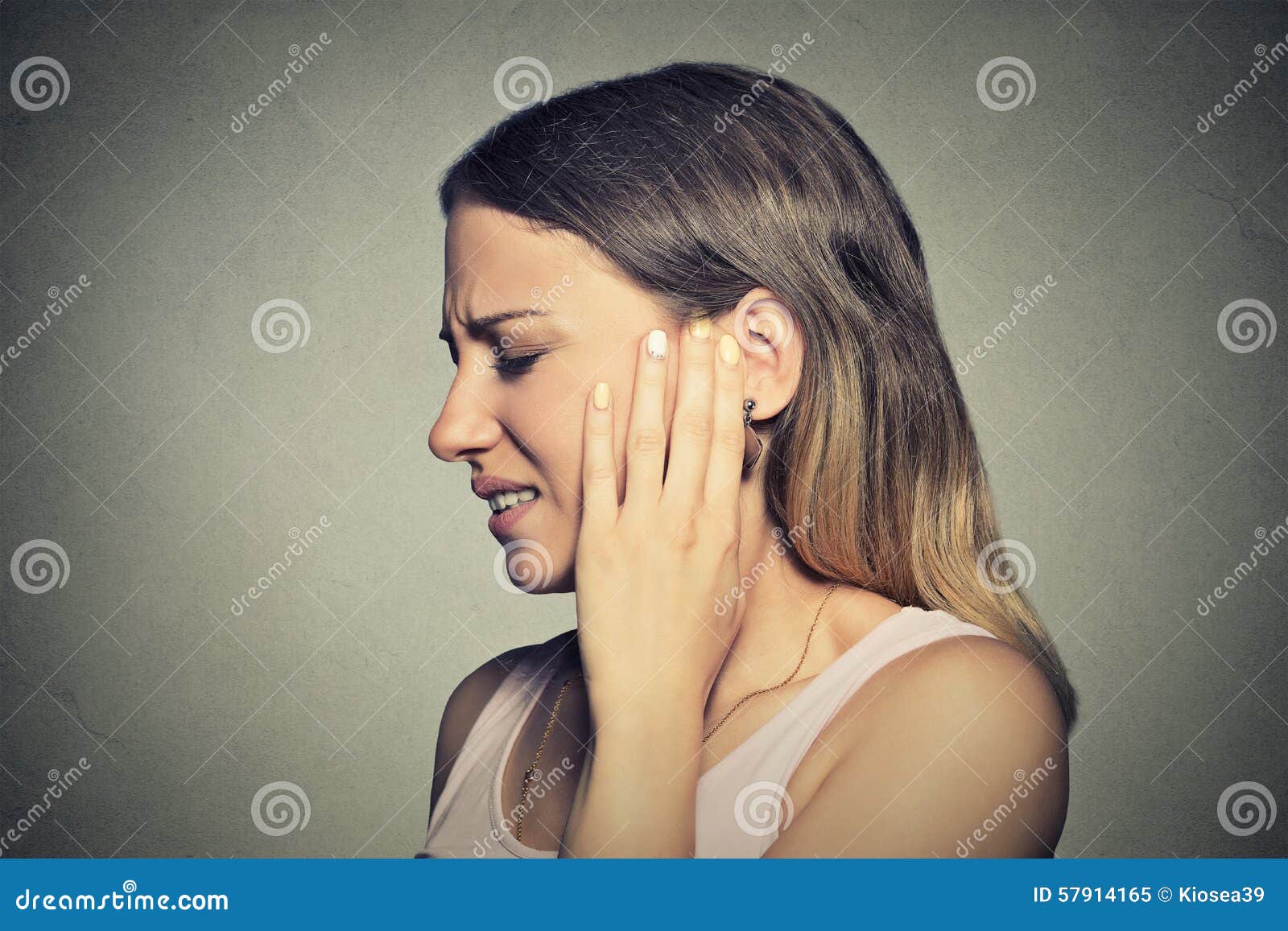 side profile sick young woman having ear pain