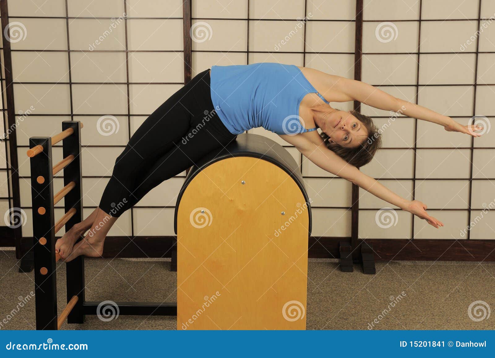 Side Stretch on Pilates Barrel Stock Image - Image of wellbeing